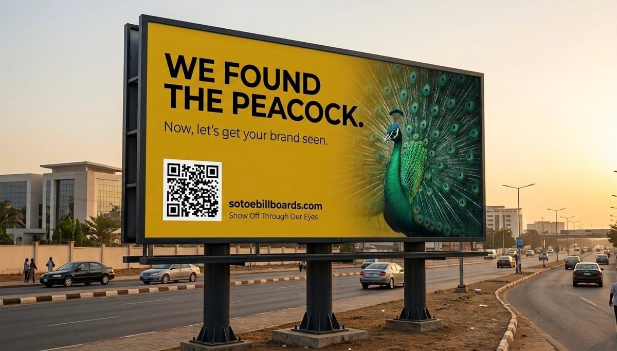 A large billboard displaying We found the peacock message with a QR code and peacock image, positioned on a city street at sunset